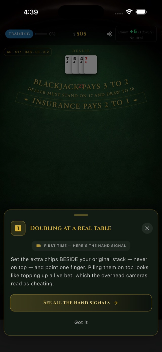 An etiquette card titled Doubling at a real table, explaining that you set the extra chips beside your original stack and never on top, then point one finger, because piling chips on a live bet reads as cheating to the overhead cameras.